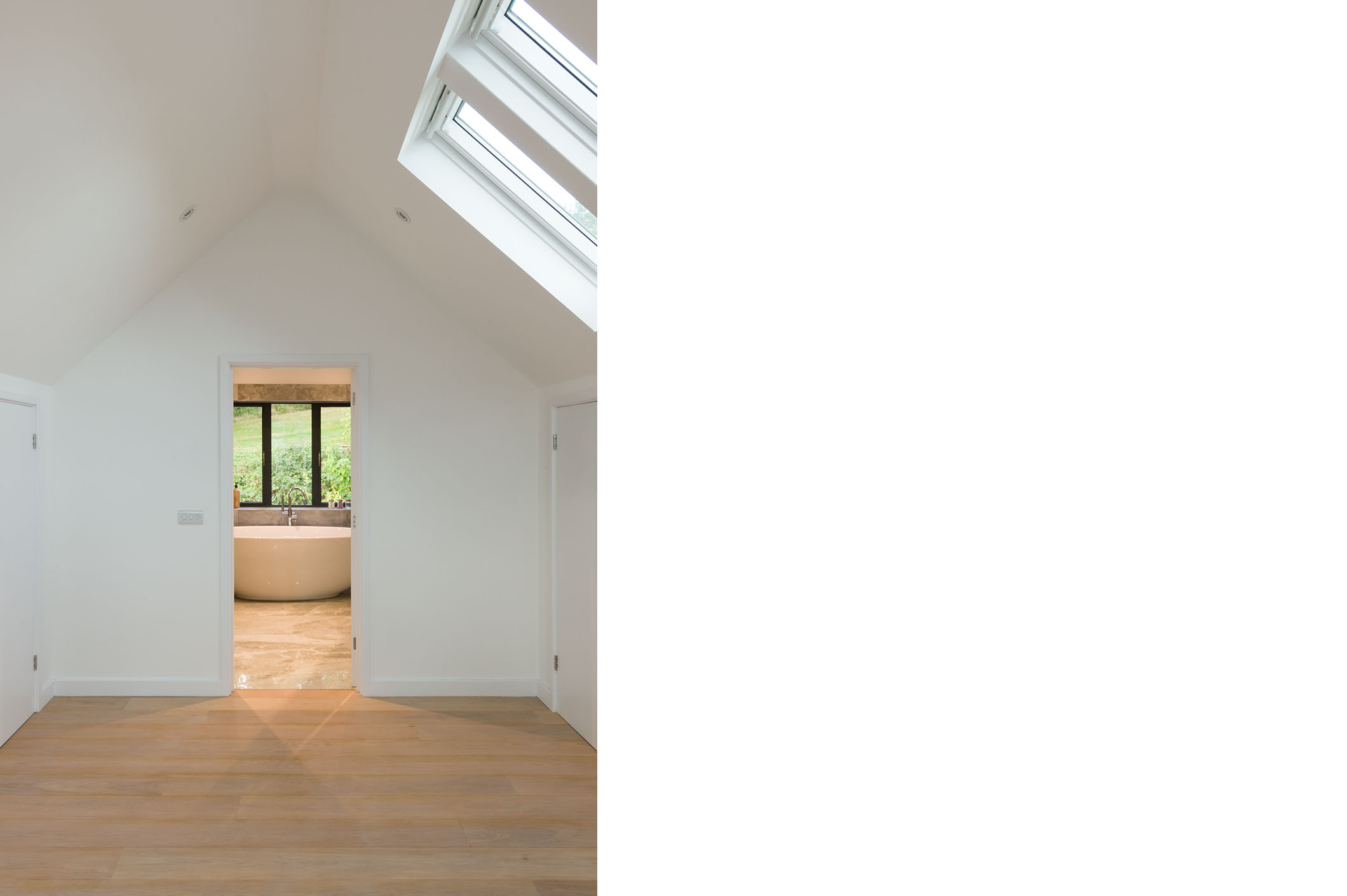 A generous master bathroom and dressing area are discretely included.